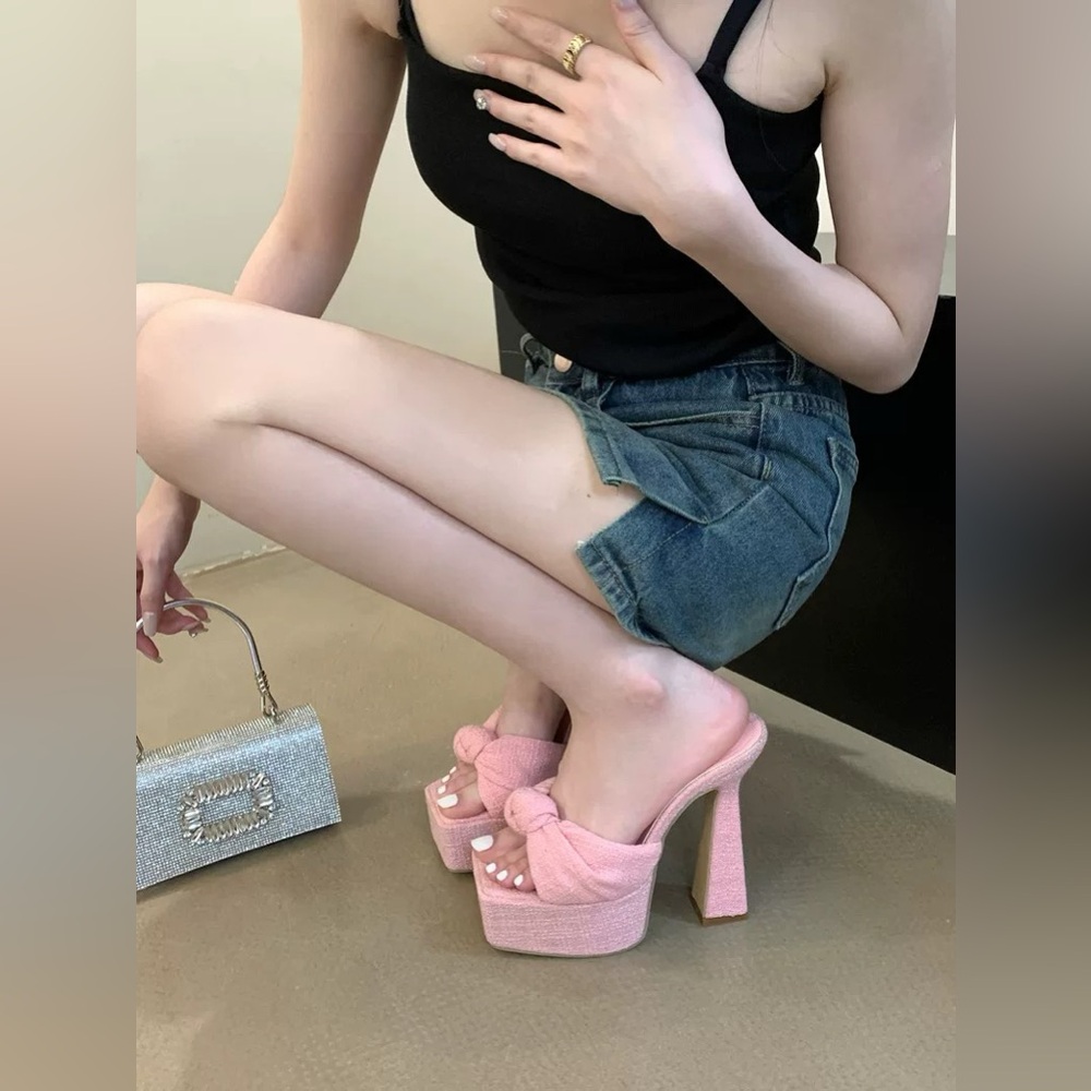 Pink platform heels with bow